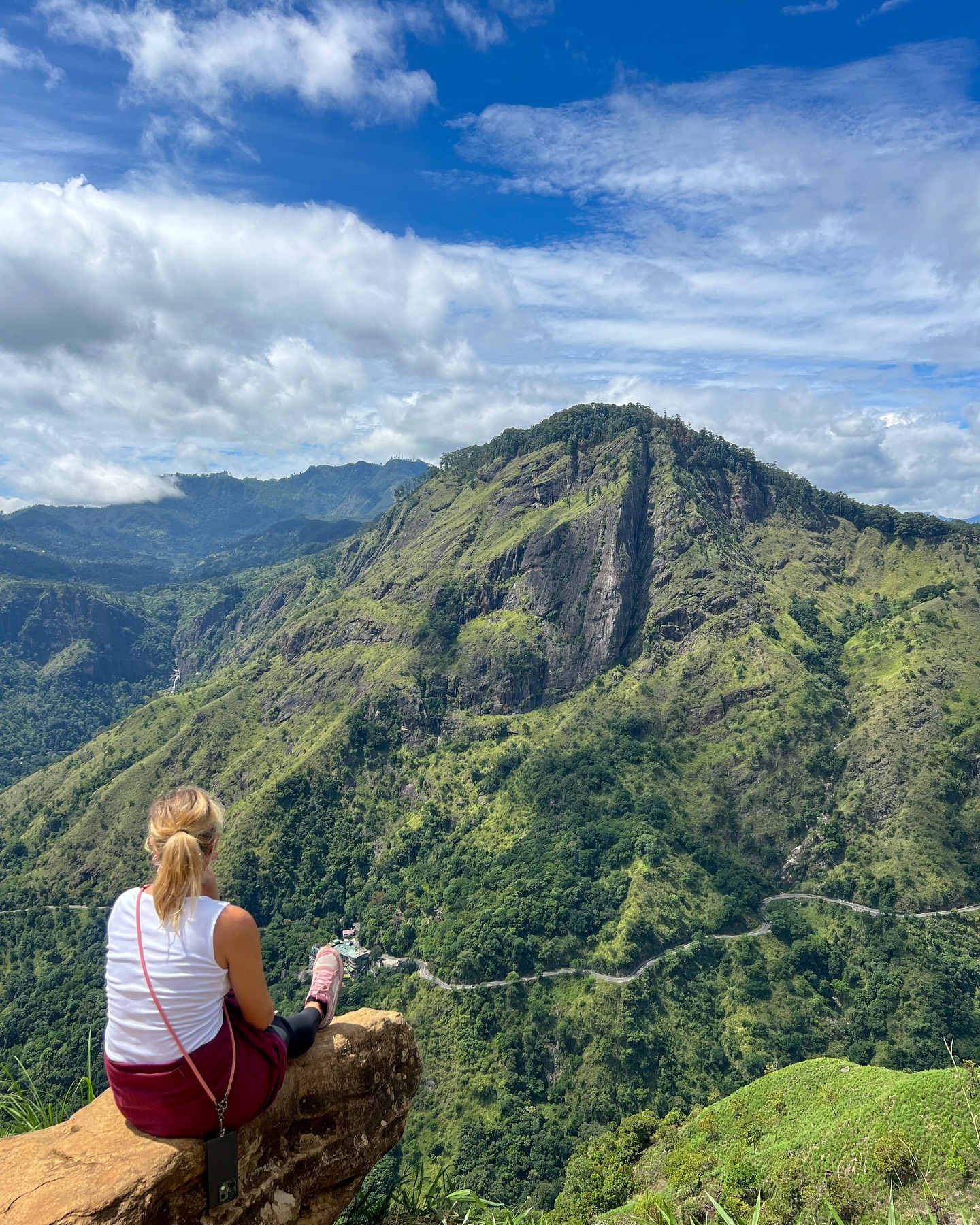 Woman overlooking Ella Rock mountain view Sri Lanka